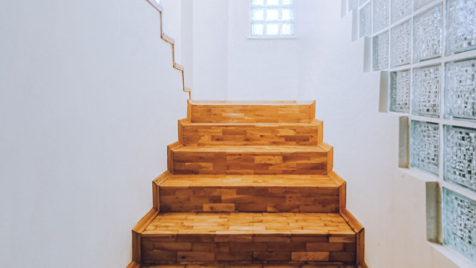 Wooden staircase representing five revenue streams stacked in order for course creators